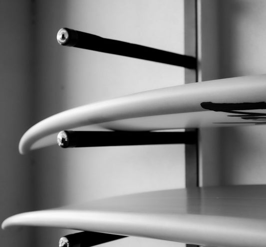 Close up of a surfboard on the wall mounted GF14/4H surfboard rack
