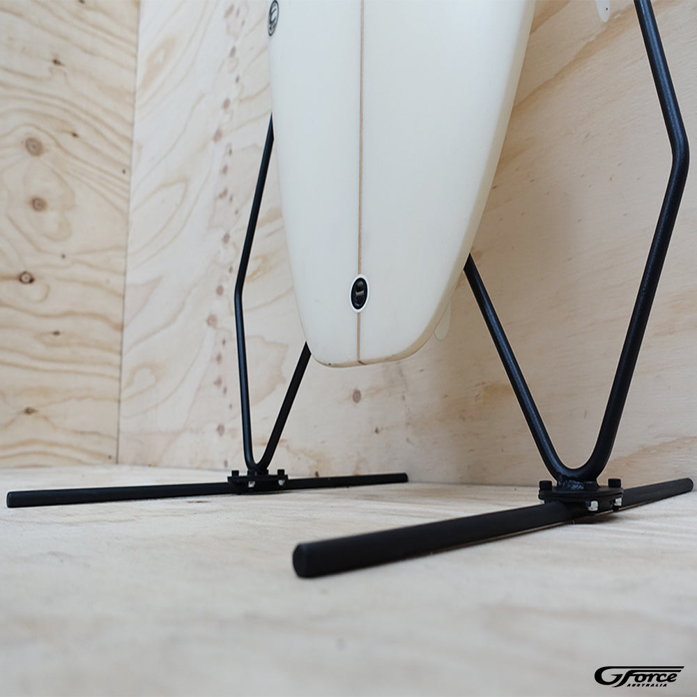 Close-up of the bottom frame of the GF6 - Freestanding Surfboard Rack holding a surfboard