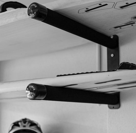 Two stand up paddle boards horizontally stacks on the wall mounted G-Force GFSUP2 SUP rack