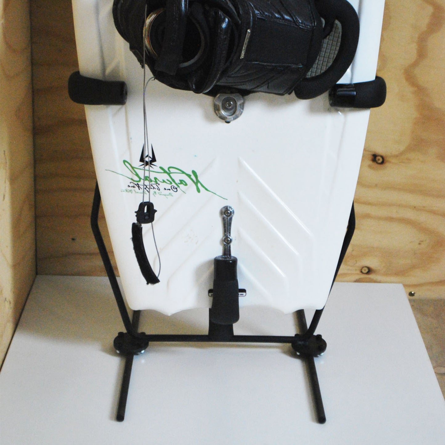 Close-up of the GF8W - Freestanding Wakeboard Rack holding a wakeboard upright