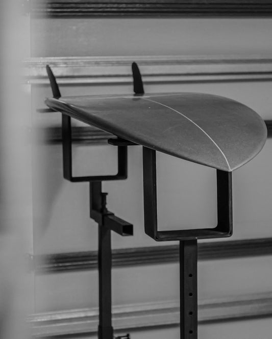 Surfboard lying on the G-Force Adjustable Shaping Rack