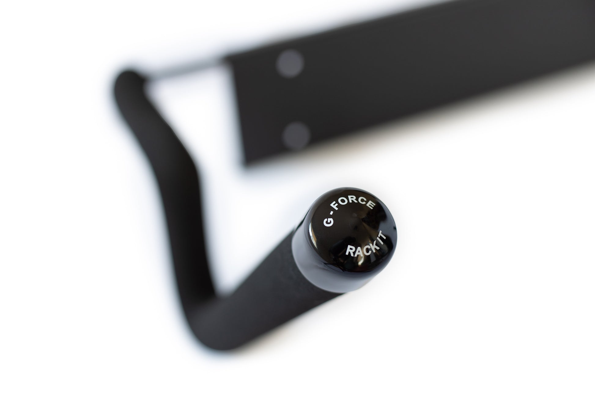 Closeup of a G-Force single board wall mounted surfboard rack on a white background