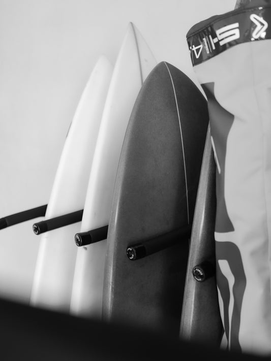 Five surfboards standing up in the G-Force GF14/6V wall mounted surfboard rack