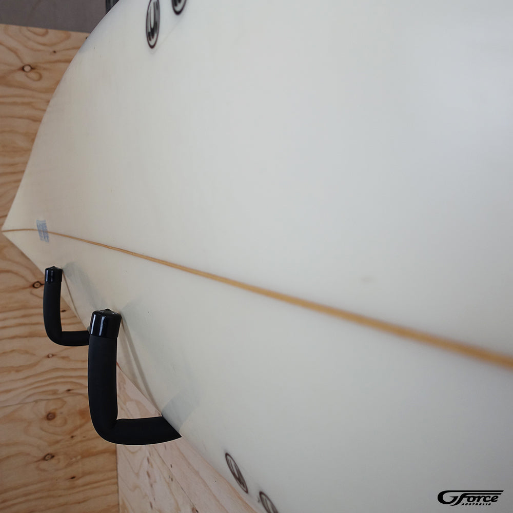 Close-up of the GF3P - Wall Mounted Surfboard Rack holding a surfboard