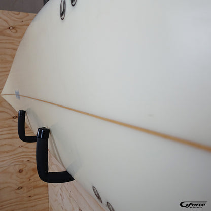 Close-up of the GF3P - Wall Mounted Surfboard Rack holding a surfboard