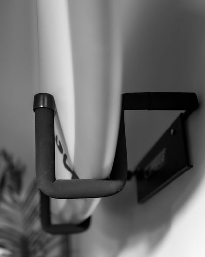 Closeup of a surfboard on the wall mounted GF3P surfboard rack