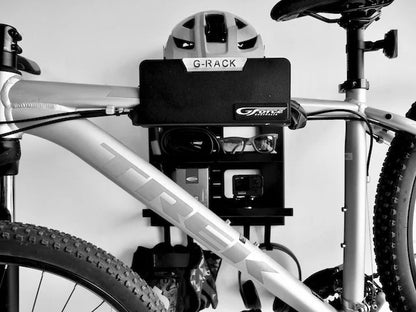 G-Force wall mounted G-Rack Model 2 Bike Rack holding a bike, helmet, sunglasses & other bike riding accessories