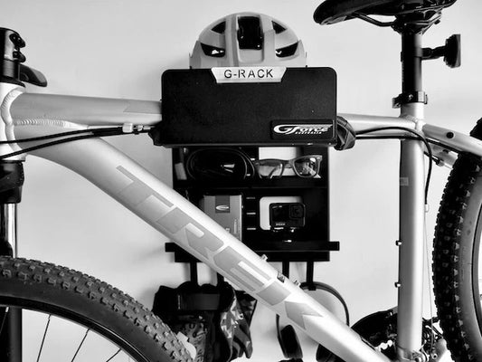 G-Force wall mounted G-Rack Model 2 Bike Rack holding a bike, helmet, sunglasses & other bike riding accessories