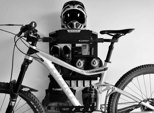 G-Force wall mounted G-Rack Model 4 Bike Rack holding a mountain bike, helmet & bike riding accessories