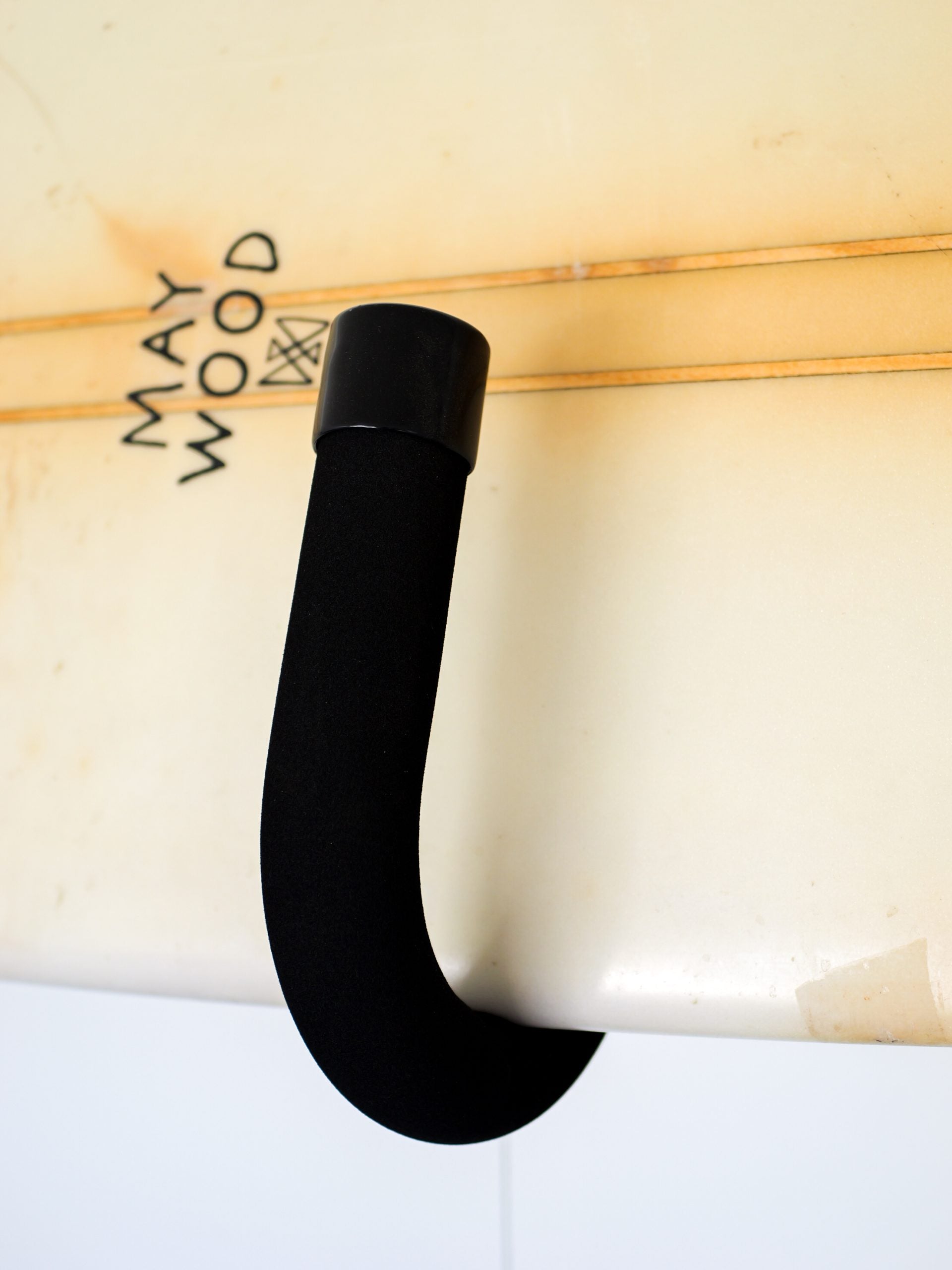 Close-up of a bar on the GFSUP1 - Wall Mounted Stand Up Paddle Board Rack holding a stand up paddle board