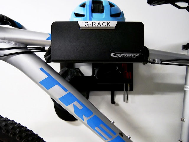 Close-up of the G-Rack Model 3 - Wall Mounted Bike Rack holding a bicycle and helmet
