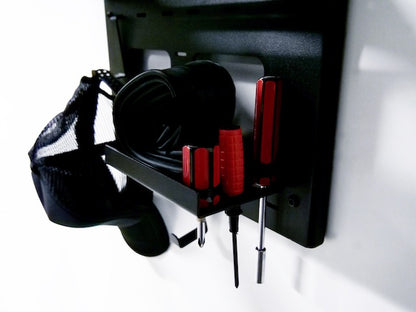Close-up of the G-Rack Model 3 - Wall Mounted Bike Rack holding a hat, bicycle tools and other bike riding accessories