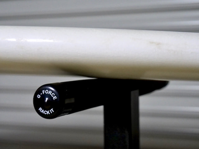 A close-up of the G-Force Surfboard Glassing Rack holding a surfboard