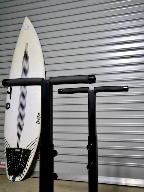 The G-Force Surfboard Glassing Rack featuring a surfboard