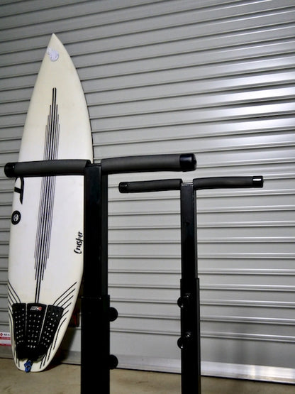The G-Force Surfboard Glassing Rack featuring a surfboard