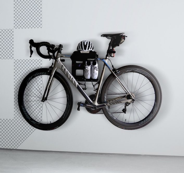 The G-Rack Model 2 - Wall Mounted Bike Rack holding a bicycle, helmet and shoes