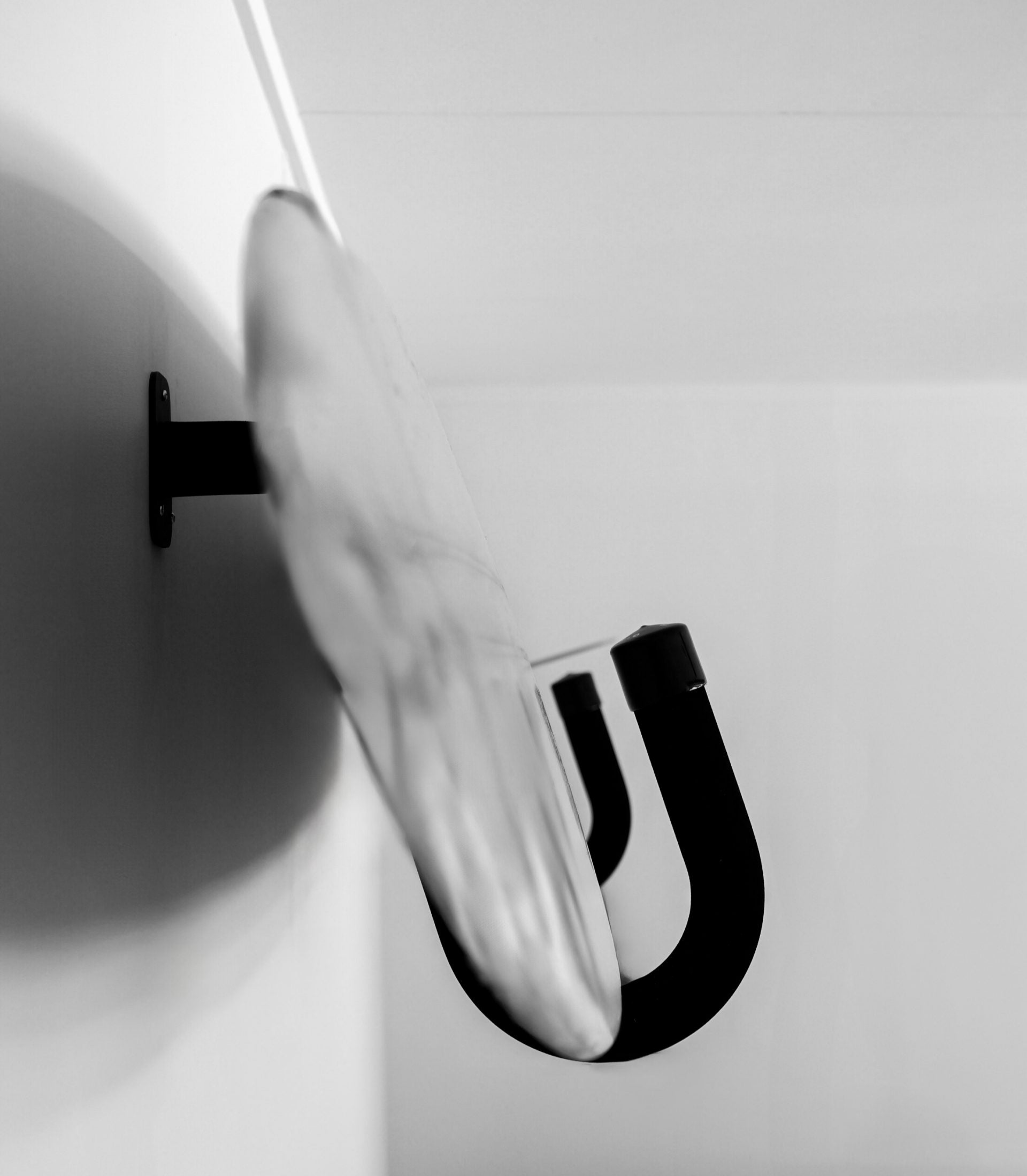 Wall mounted G-Force stand up paddle board rack holding a board