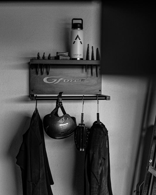 Wall mounted Wetsuit & Fin Rack holding wetsuits, fins & other surfing accessories