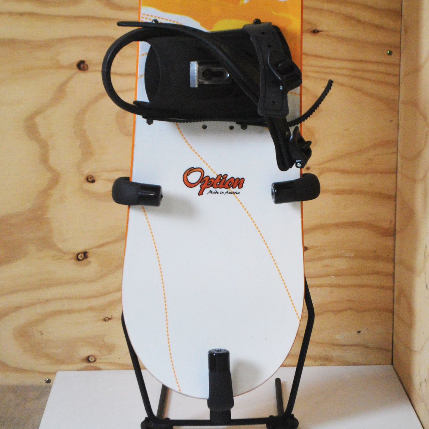 The GF8S - Freestanding Snowboard Rack holding a snowboard